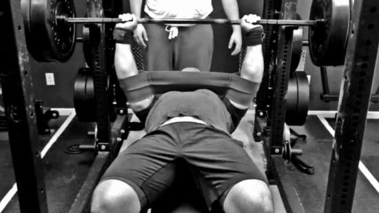 Bench pressing with slingshot.